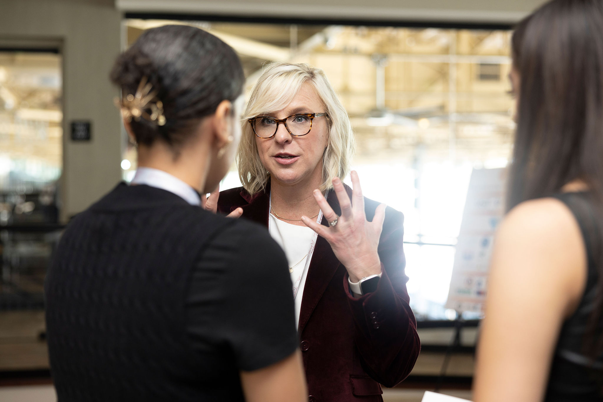professional asking thoughtful questions in conversation